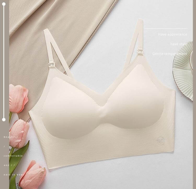 invisible plunge bra for backless dresses on a flat surface with pink flowers and a decorative plate.