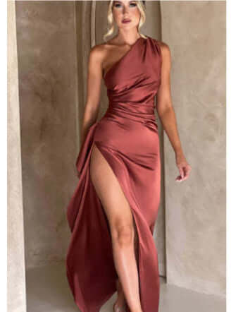 Viviane Pierre one-shoulder backless slit dress in rust color, showcasing elegant design and thigh-high slit.