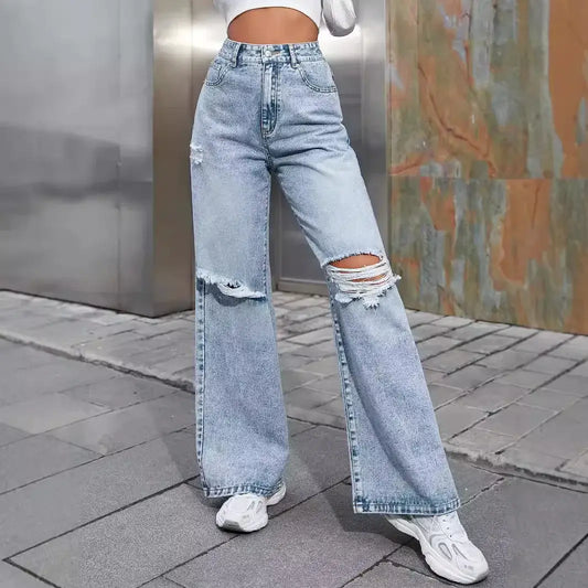 Women wearing ripped high waist wide leg jeans, showcasing casual style and comfort in light blue denim.