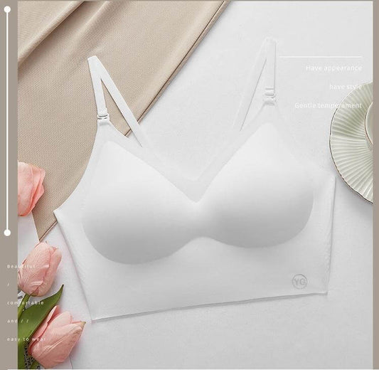 invisible plunge bra for backless dresses displayed on a minimalistic background with flowers.