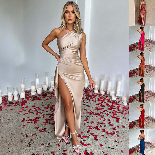 Viviane Pierre one-shoulder backless slit dress showcased in a stylish setting with rose petals and candles.
